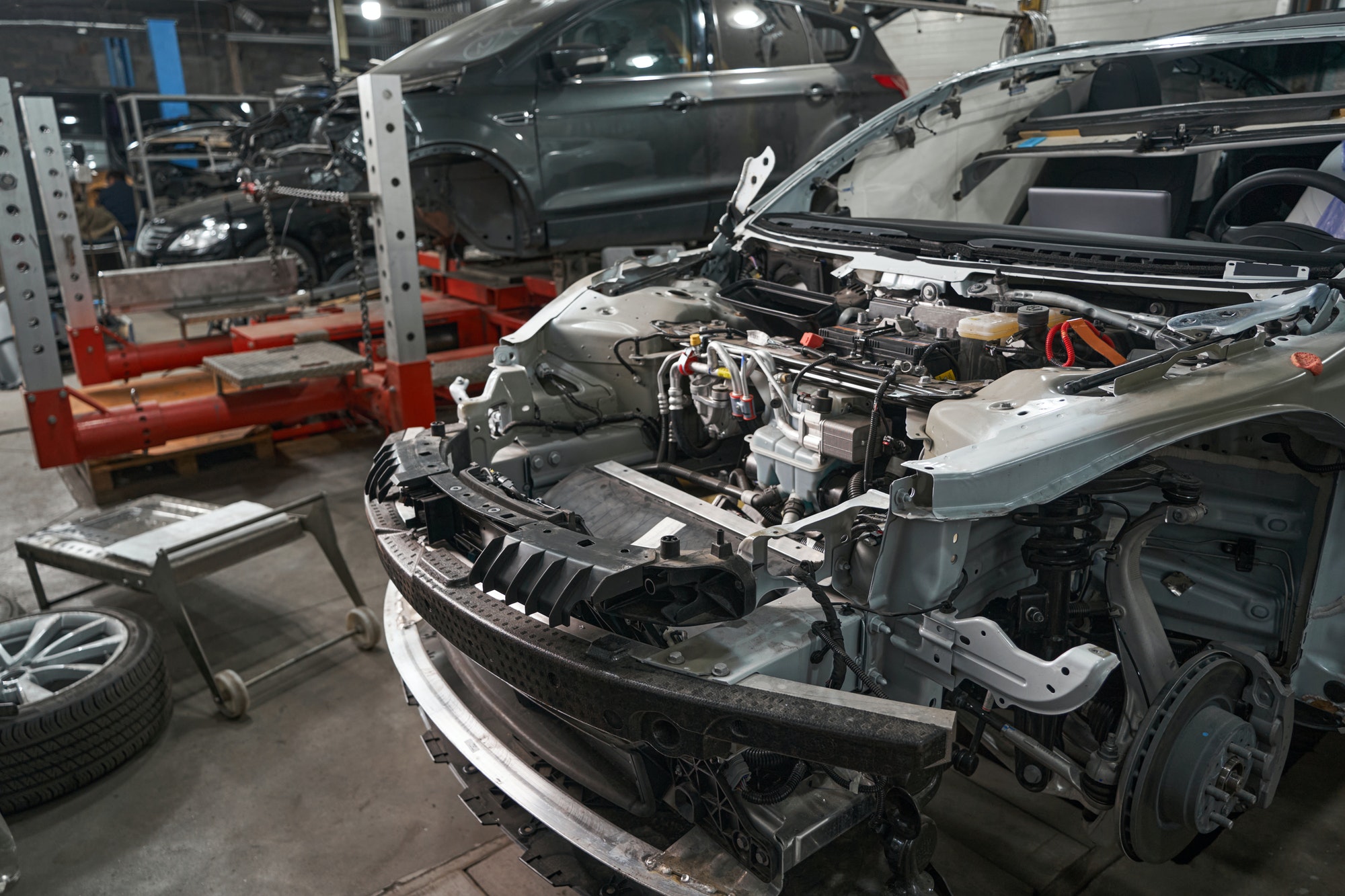 Disassembled car parts during repairs in service center
